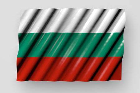 wonderful shining flag of Bulgaria with big folds lying flat isolated on gray - any holiday flag 3d illustrationの写真素材