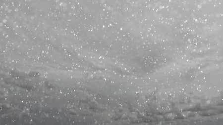 cute fall of snow on clouds on sky backdrop - photo of natureの写真素材