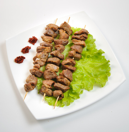 vegetarian  meat for catalog on a white plate isolated background green leafの写真素材