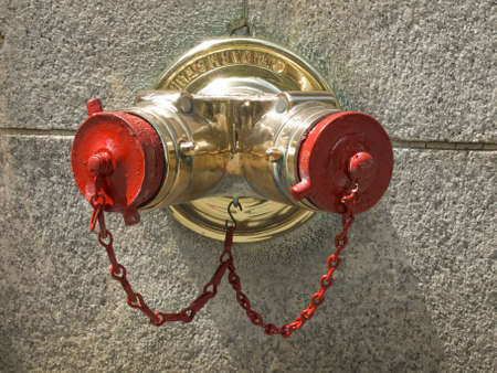 A standpipe on a New York City wall.の写真素材