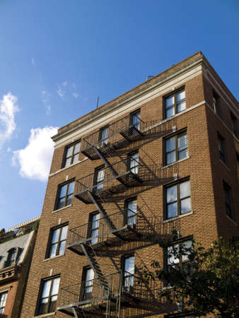 A classic brownstone building in west midtown, NYC.の写真素材