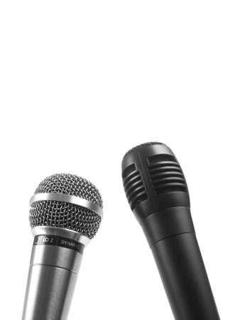 A black and a silver microphone over a white background. Copy space.の写真素材
