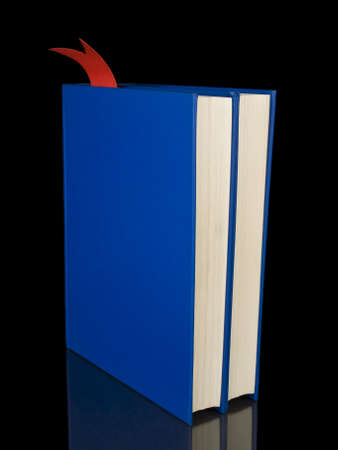 Two blue books isolated on black background.の写真素材