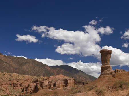 A remote desert landscape with a large sandstone structure formation.の写真素材