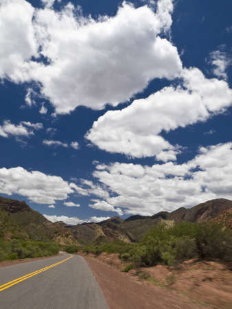 Driving on a road through a mountain landscape.の写真素材