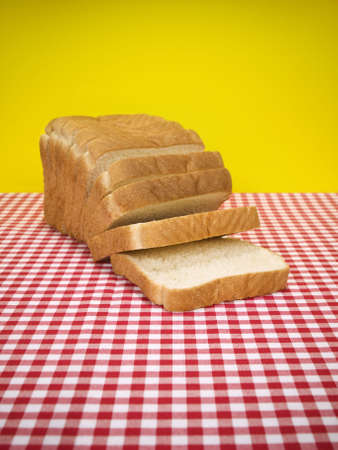 Sliced loaf of bread over the table.の写真素材