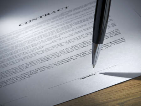 Close up of a pen about to sign the contract.の写真素材