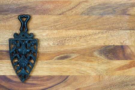 Antique cast iron on wooden backgroundの写真素材