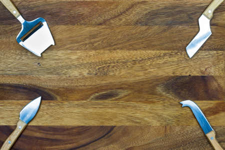 Cheese knife set with wooden backgroundの写真素材