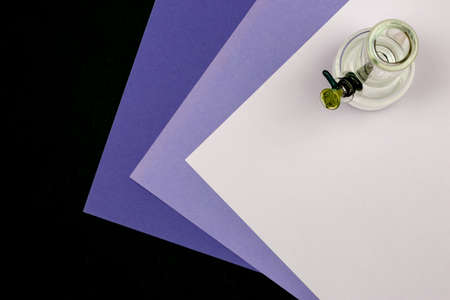 Glass bong packed with weed on purple, ultraviolet and black backgroundの写真素材