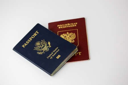 US and Russian Passports arranged on white isolatedの写真素材