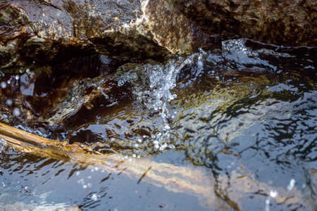 Cold waves breaking on boulders off the coast of Michigan in Springの写真素材