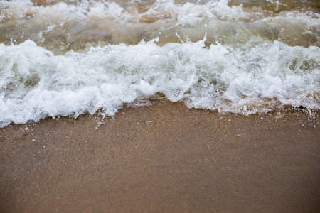 Chilling waters of Lake Michigan washing ashore in springの写真素材