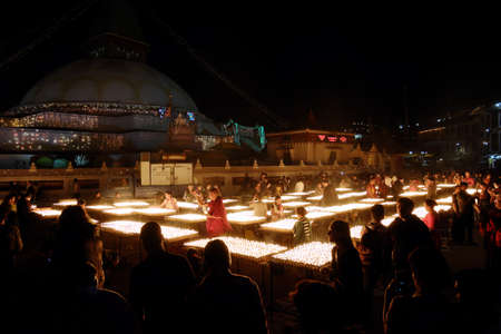 NEPAL. KATHMANDU â MAY 03, 2017 : The offering of burning oil lamps near the stupa  Bouddanath in Kathmandu. Kathmandu is the capital and the largest city of Nepal.のeditorial素材