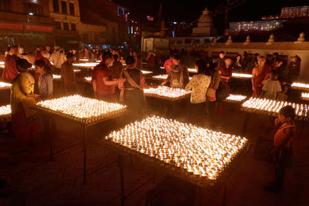 NEPAL. KATHMANDU â MAY 03, 2017 : The offering of burning oil lamps near the stupa  Bouddanath in Kathmandu. Kathmandu is the capital and the largest city of Nepal.のeditorial素材