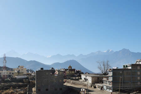 NEPAL. MUKTINATH - NOVEMBER 18, 2016 : View of Muktinath in the background of the silhouette of the Himalayas and Mount Nilgiri. Muktinath is an ancient city in the Himalayas with a great religious and tourist significance for Nepal.のeditorial素材