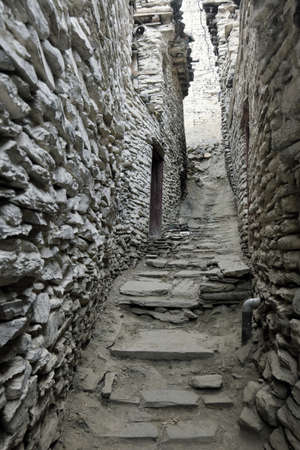 A stone street in the amazing old Nepalese mountain village Marphaの写真素材