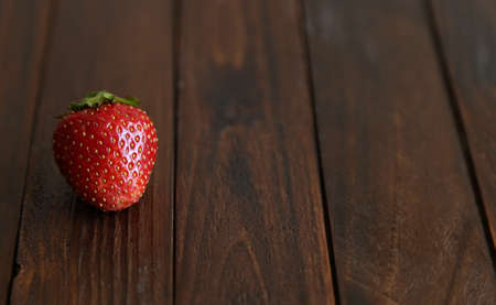 juicy strawberries on wooden backgroundの写真素材