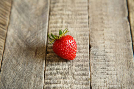 juicy strawberries on wooden backgroundの写真素材