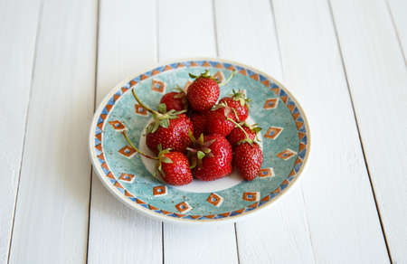 juicy strawberries on wooden backgroundの写真素材