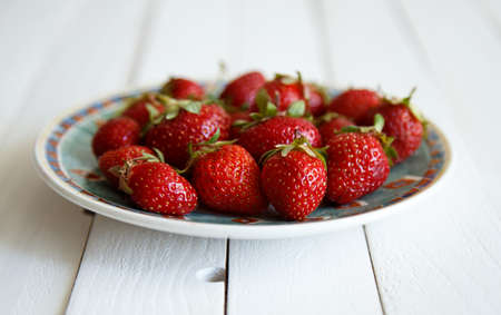juicy strawberries on wooden backgroundの写真素材