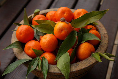 beautiful juicy tangerines in a jugの写真素材