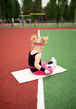 Sports little girl doing fitnessの写真素材
