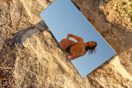 Beautiful girl in lingerie on the beachの写真素材