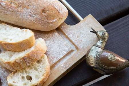 Ciabatta bread on cutting board.