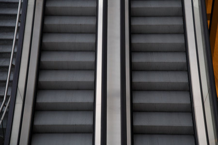 Escalators in a modern shopping center, closeup of photoの写真素材