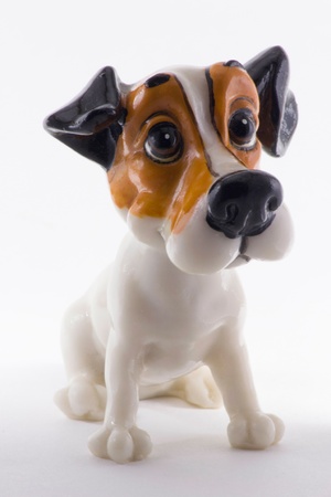 statue of a dog with a muzzle on raznochvetnoy free light backgroundの写真素材