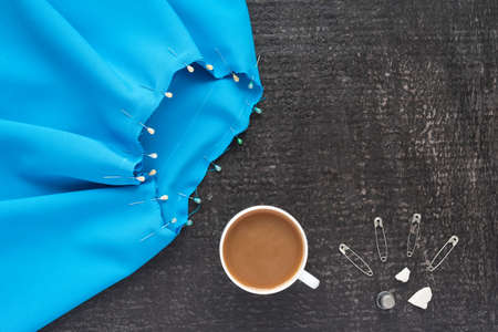 Needlework and coffee on black backgroundの写真素材