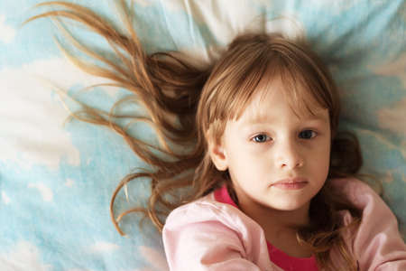 Portrait of a little girl with long hairの写真素材