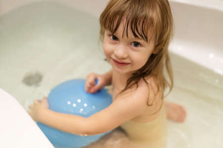 Little girl in a bathroomの写真素材