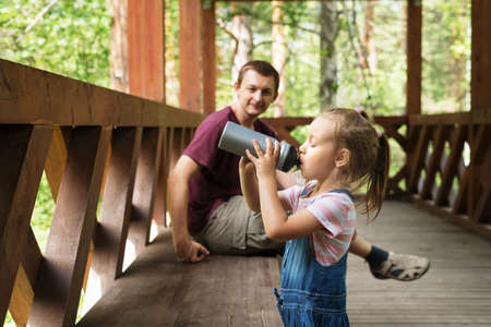 Father and daughter in the woodsの写真素材