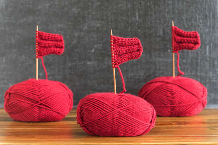 Sailing ships made from red yarn and wooden knitting needles.の写真素材