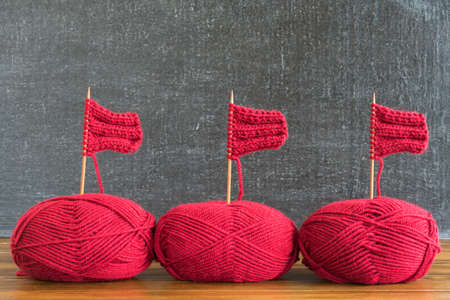 Sailing ships made from red yarn and wooden knitting needles.の写真素材