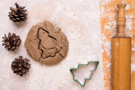 Making cookies in shape of Christmas treeの写真素材