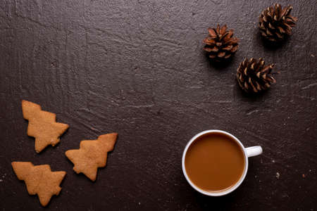 Coffee with cookies in shape of Christmas treeの写真素材