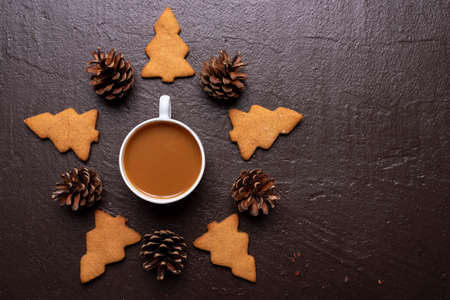Coffee with cookies in shape of Christmas tree
