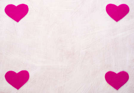 Background with hearts made of pink feltの写真素材