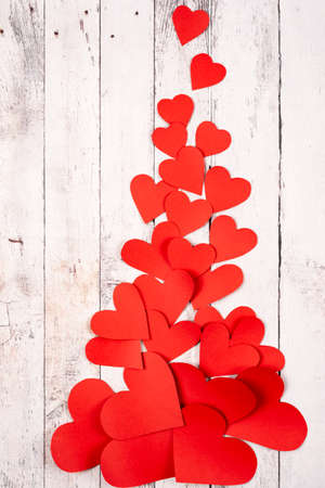 Flatlay composition with hearts on a wooden backgroundの写真素材