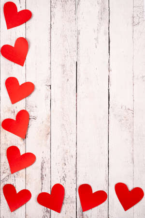 Flatlay composition with hearts on a wooden backgroundの写真素材