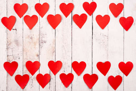 Flatlay composition with hearts on a wooden backgroundの写真素材