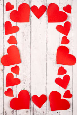 Flatlay composition with hearts on a wooden background. Love and St.Valentine's day concept.の写真素材