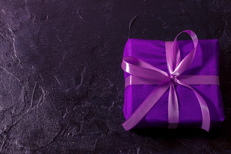 Christmas, New Year black stylish background and frame with a branch of fir and a giftの写真素材