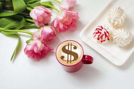 cup of coffee cappuccino with a picture of a dollar sign from cinnamon on milk foamの写真素材