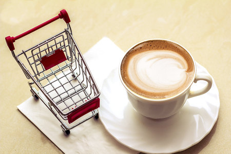 Top view of hot coffee cappuccino latte art in a ceramic glassの写真素材