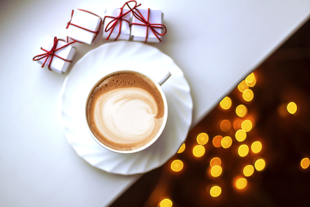 Top view of hot coffee cappuccino latte art in a ceramic glassの写真素材