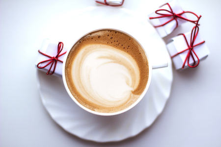 Top view of hot coffee cappuccino latte art in a ceramic glassの写真素材